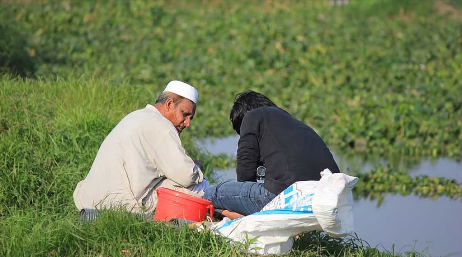 Prof Shahjahan collects samples for research (left). File photo